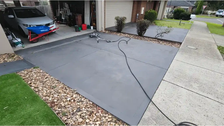 Melbourne Property Preparers driveway cleaning in Melbourne using pressure washer surface cleaner to remove dirt and stains and improve curb appeal during residential property maintenance