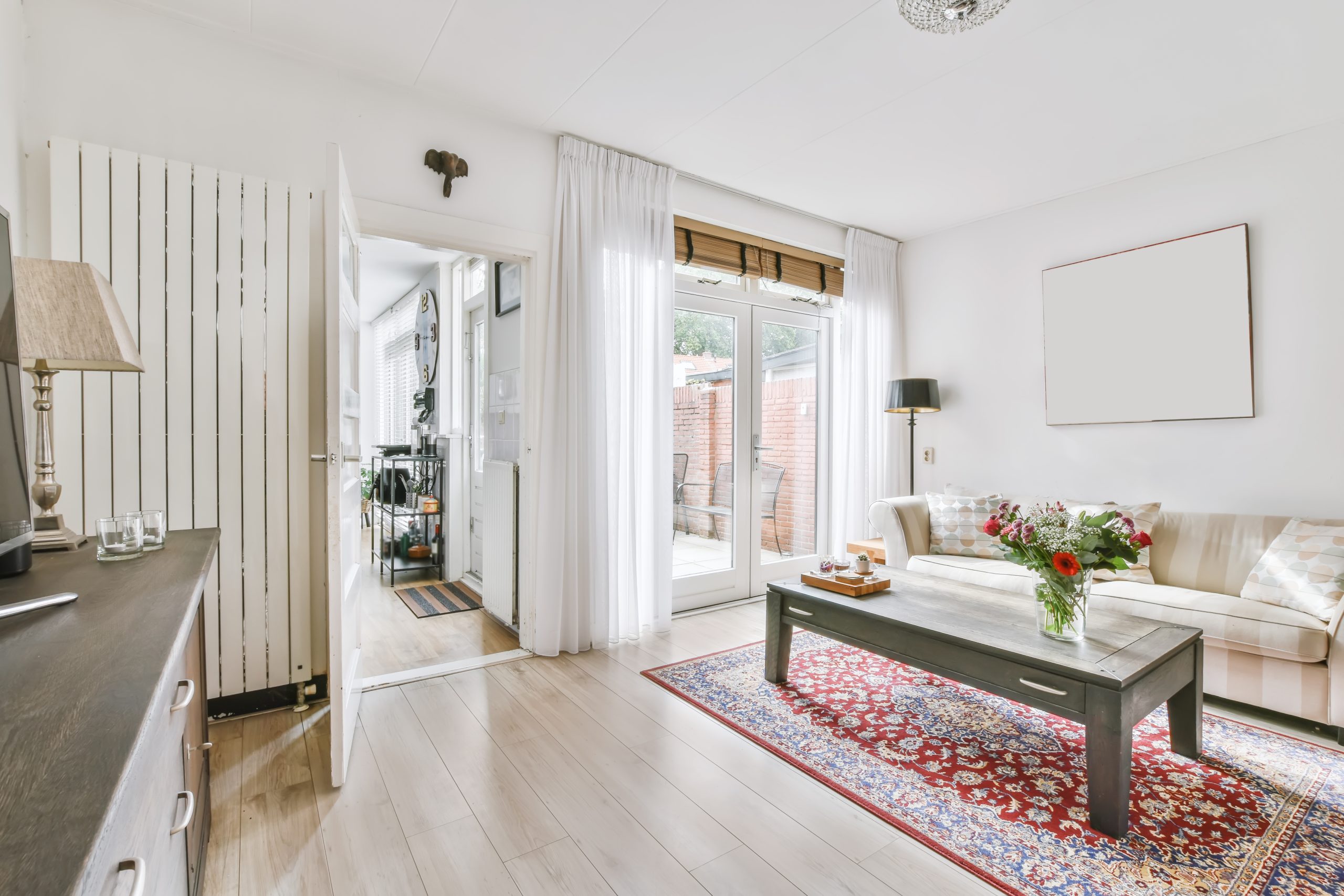 Melbourne Property Preparers showcasing bright and neatly styled living room in Melbourne with modern furniture fresh flowers and natural light to enhance property presentation for sale or rental