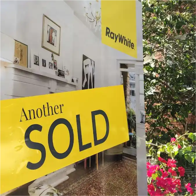 Melbourne Property Preparers sold property sign in Melbourne with Ray White branding and view of stylishly decorated interior representing successful real estate transaction and property presentation
